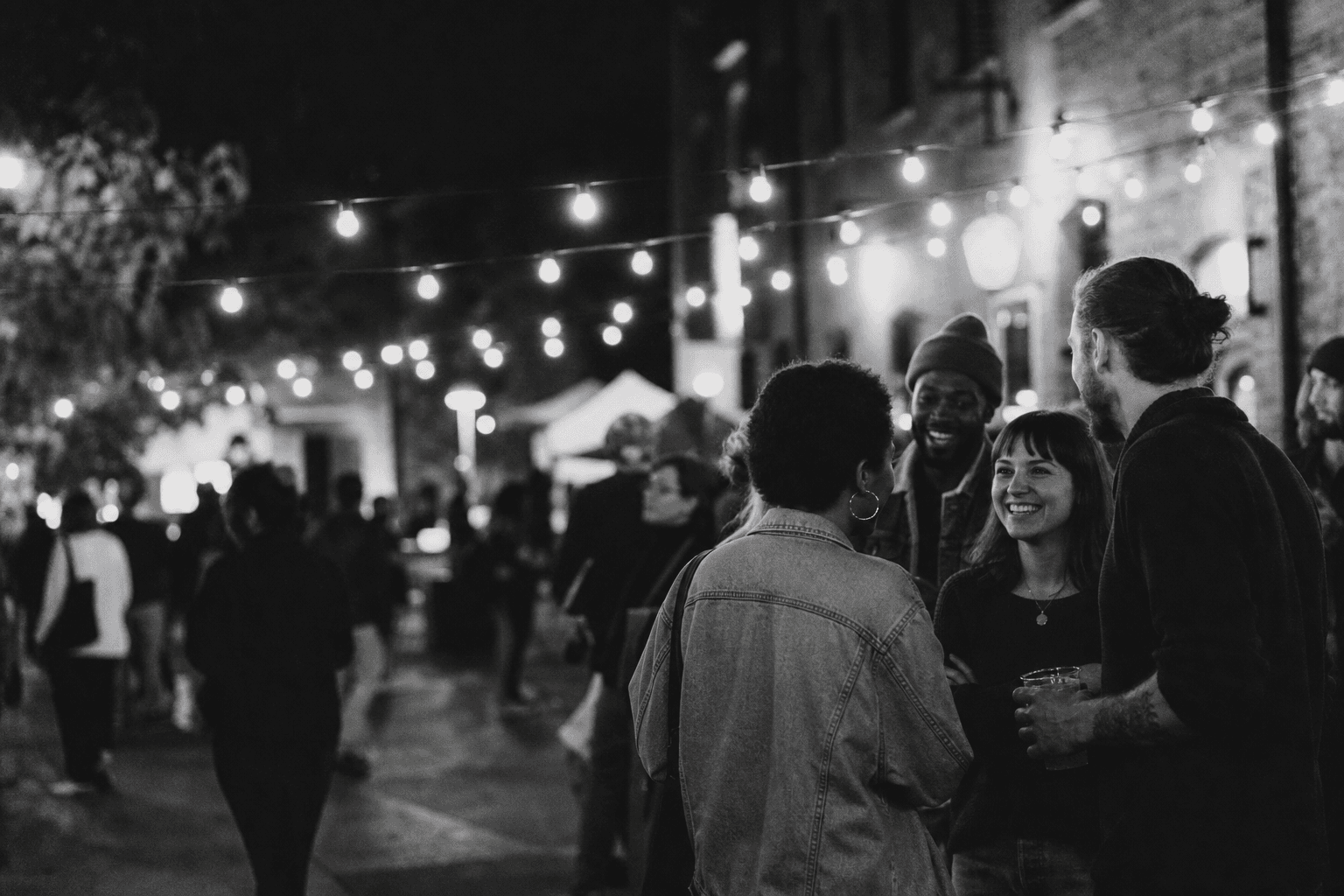 People gathering at a local evening event
